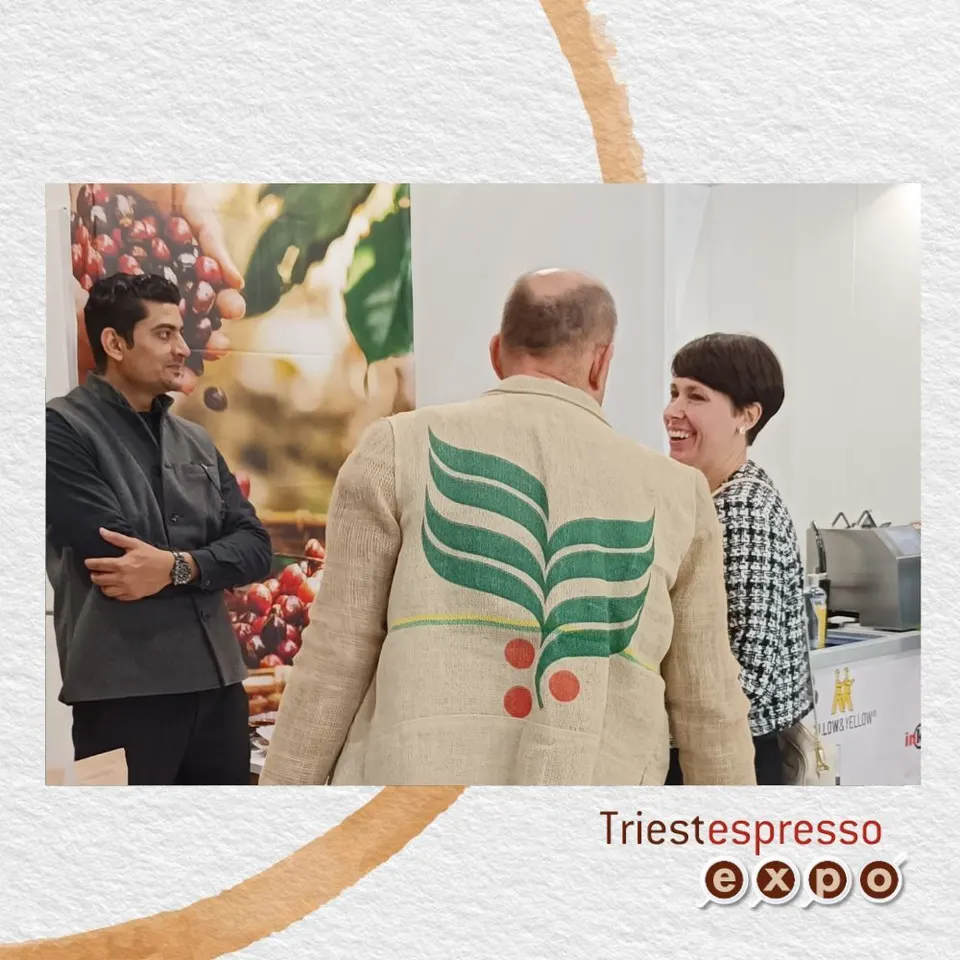 A visitor wearing a jacket made from a coffee sack