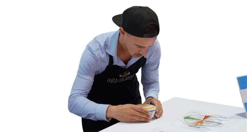 A barista pouring latte art