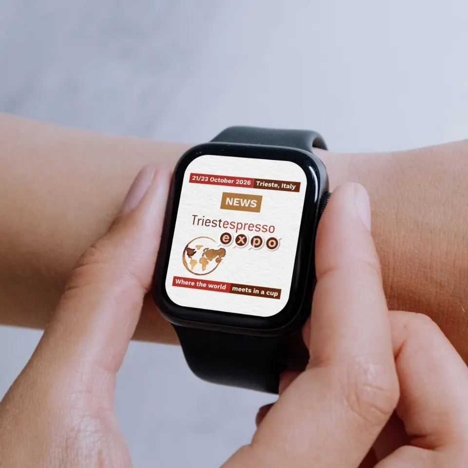 A smartwatch showing Triestespresso Expo news