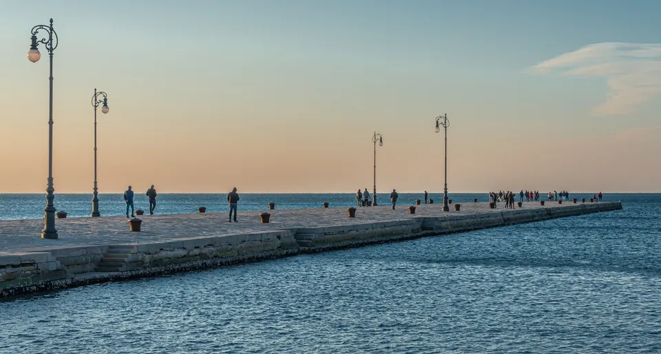 A pier on the sea at sunset